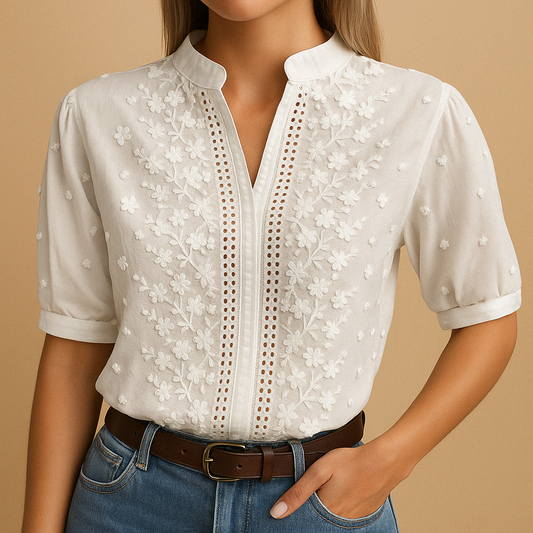 Elegant white blouse for women with a classic collar and button closure, perfect for work, casual outings, or evening wear.